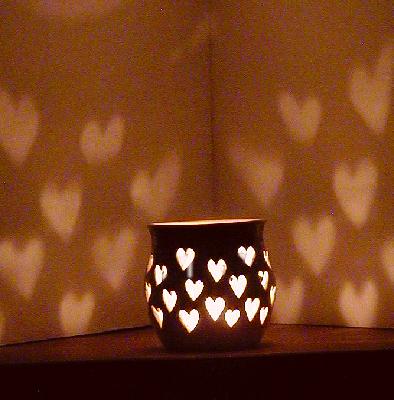 Hearts around candle cup (night)